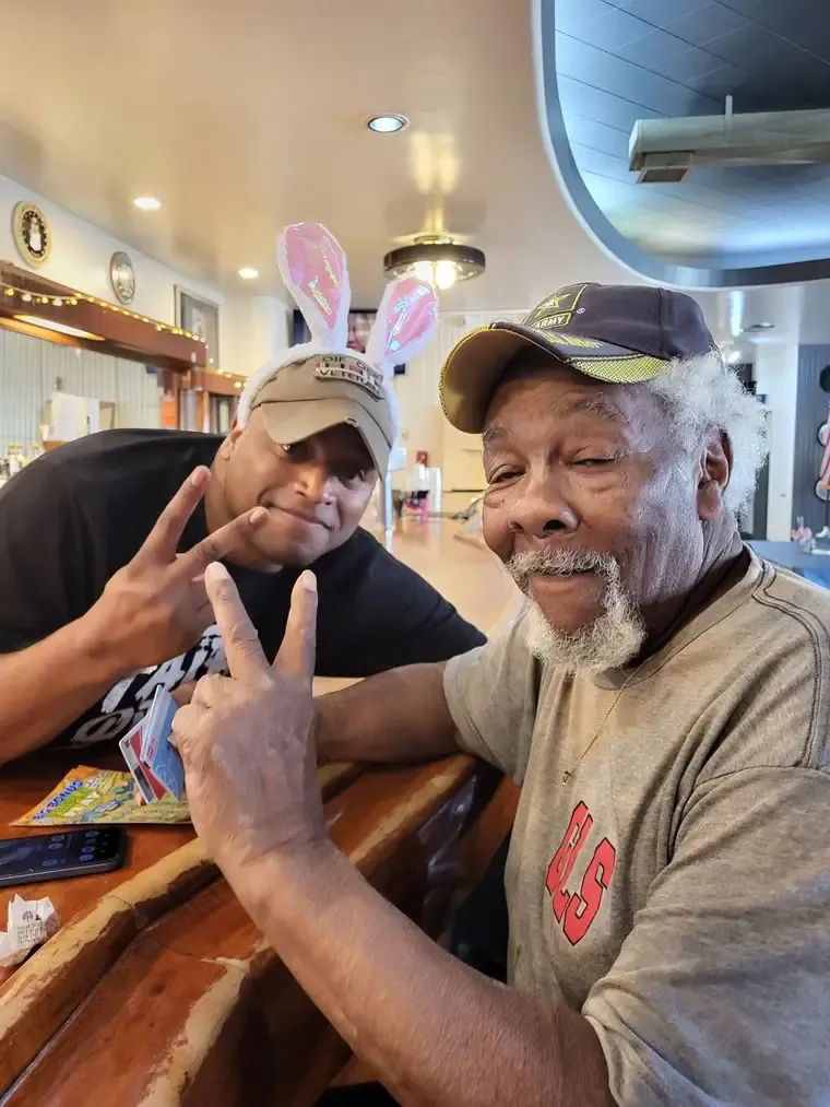 Members at the bar inside the post home